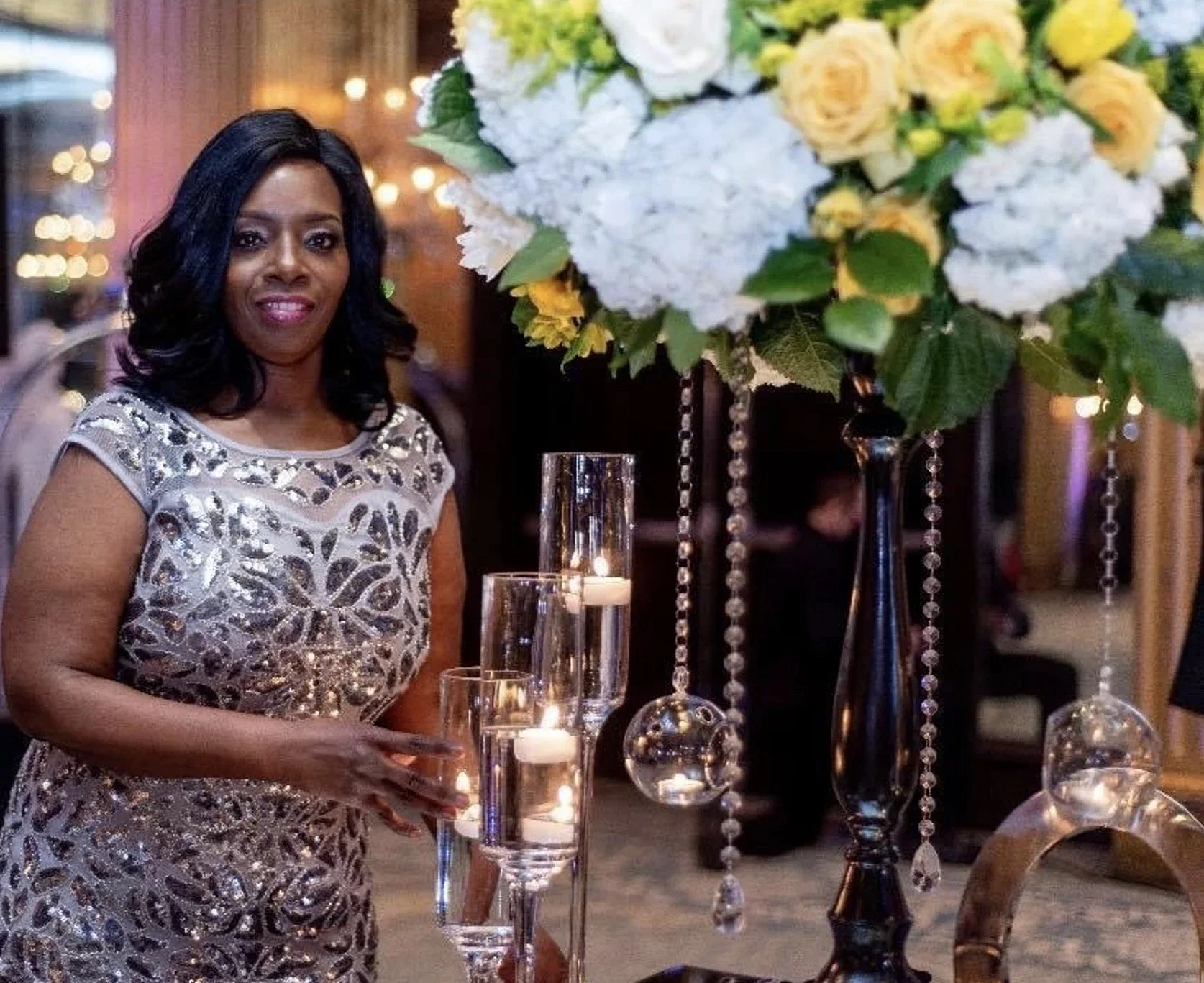 Elegant event setting with floral arrangements and candles