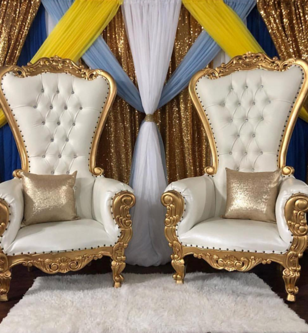 Elegant table setting with gold chargers and floral centerpieces